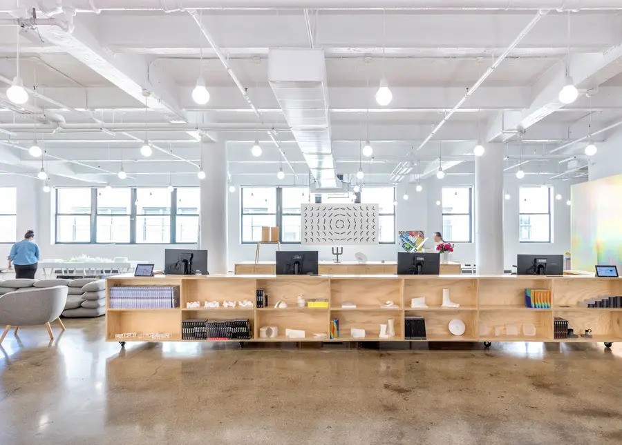 A luxury open office illuminated by Ketra lighting.