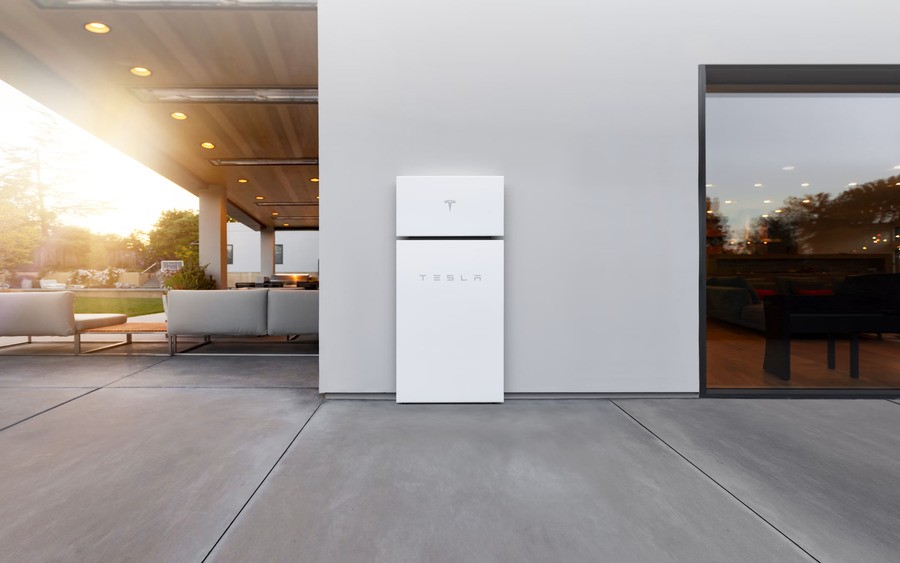 An outdoor area with a Tesla Powerwall installed.