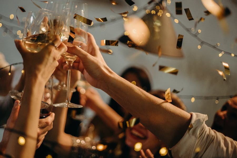 A group of friends toast at a party.