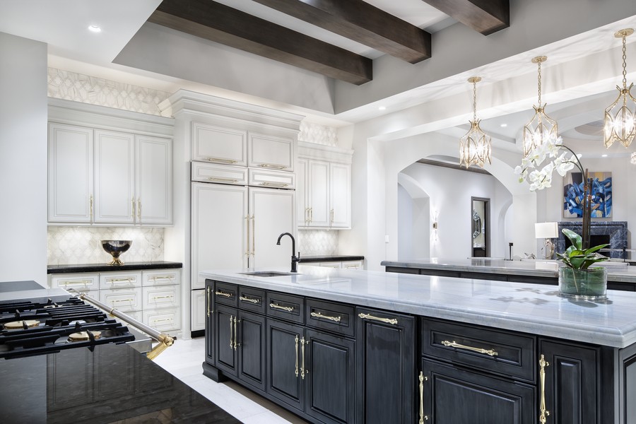 An elegant kitchen brightly illuminated by Ketra.