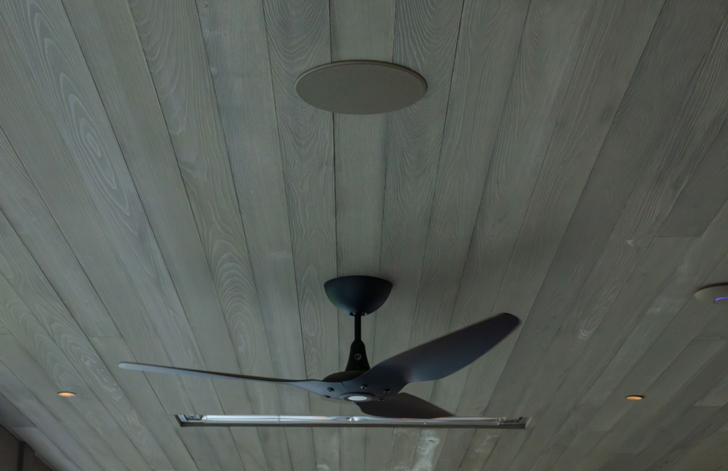 A cozy, well-designed interior showcasing layered lighting, comfortable seating, and modern decorative accents for a welcoming environment.