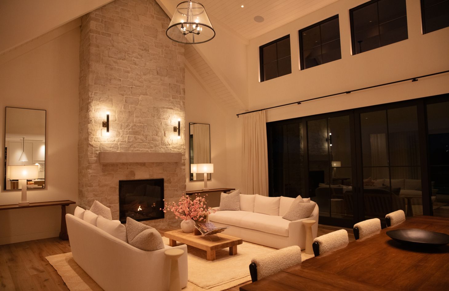 A contemporary living space featuring a large sectional sofa, a statement coffee table, and subtle accent lighting that highlights modern decor details.