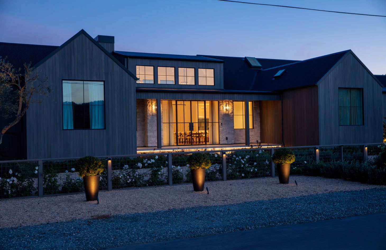 An elegant living area with a comfortable sofa, a chic coffee table, and tasteful artwork on the walls, all set in a light-filled, modern space.