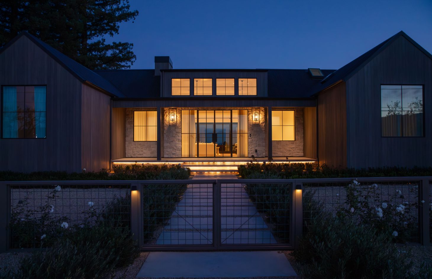 A refined room with a blend of contemporary art, sleek furnishings, and warm accent lighting that together create an atmosphere of understated luxury.