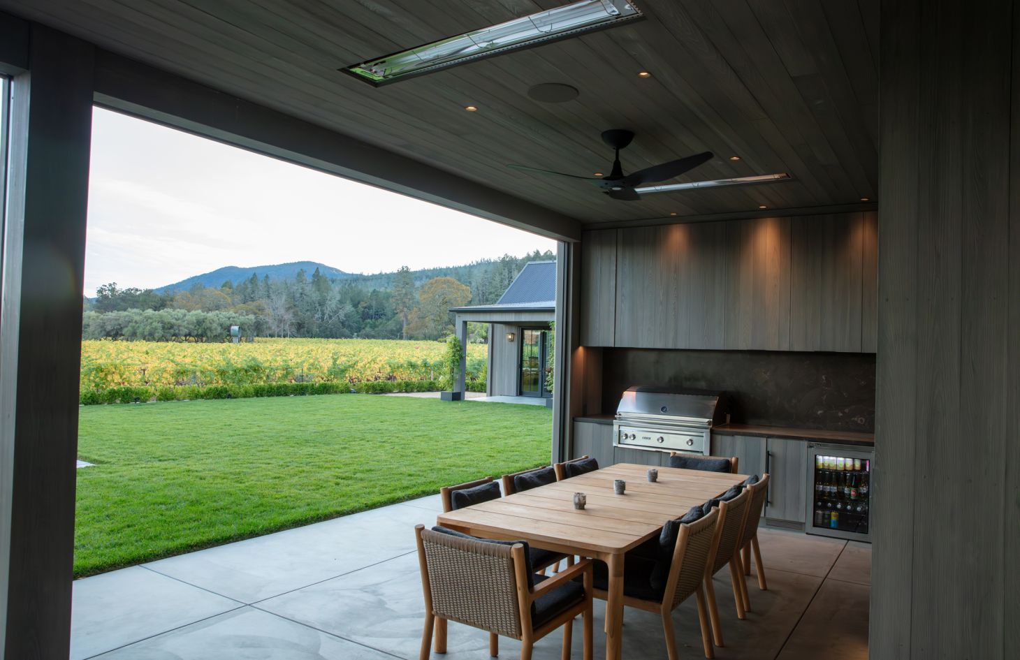 A modern living room interior featuring contemporary furnishings, large windows with natural light, and stylish decor that creates an inviting ambiance.