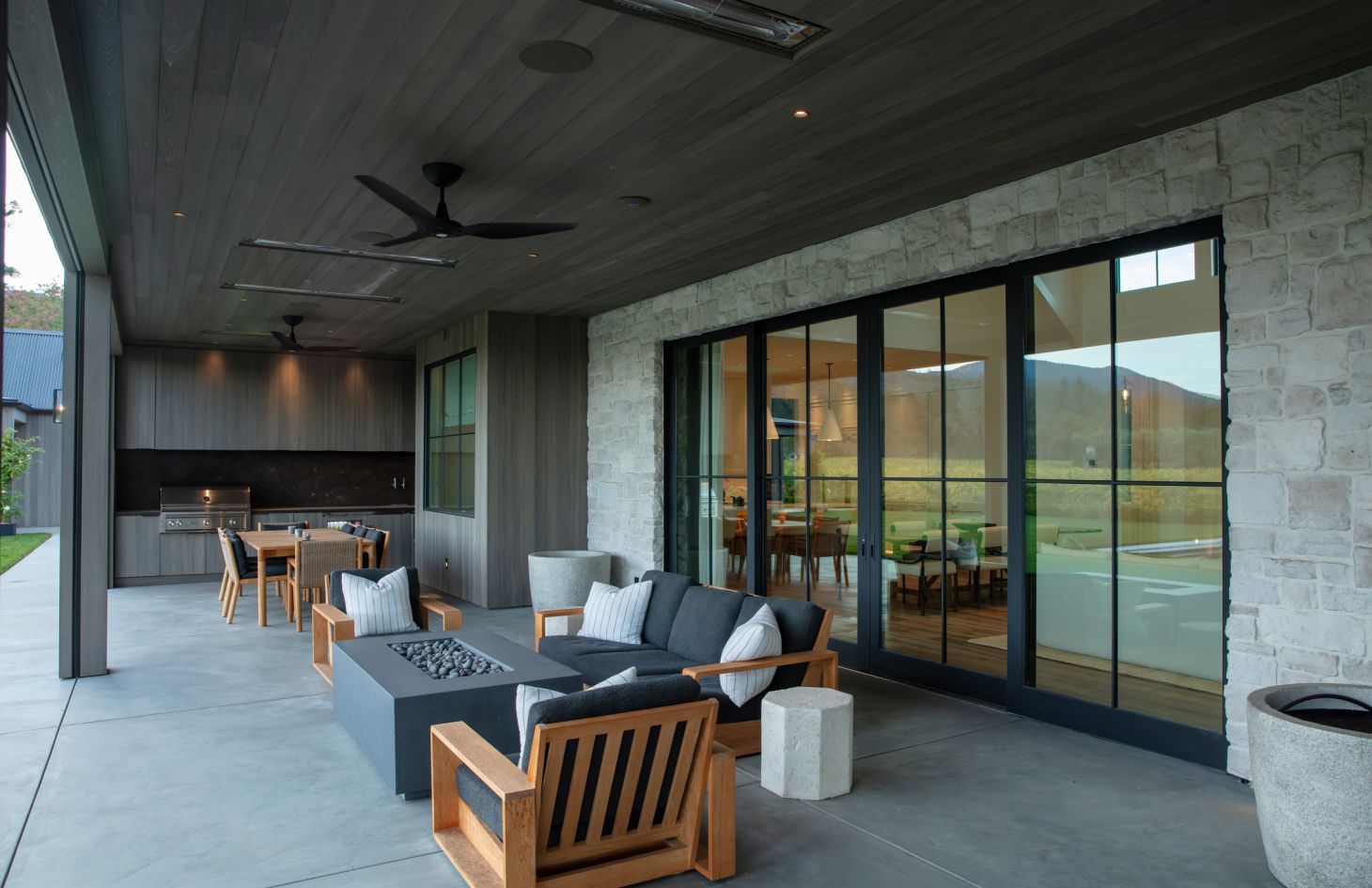 A high-resolution interior shot of a modern showroom featuring sleek furnishings, ambient lighting, and a large digital display that emphasizes a contemporary home automation aesthetic.